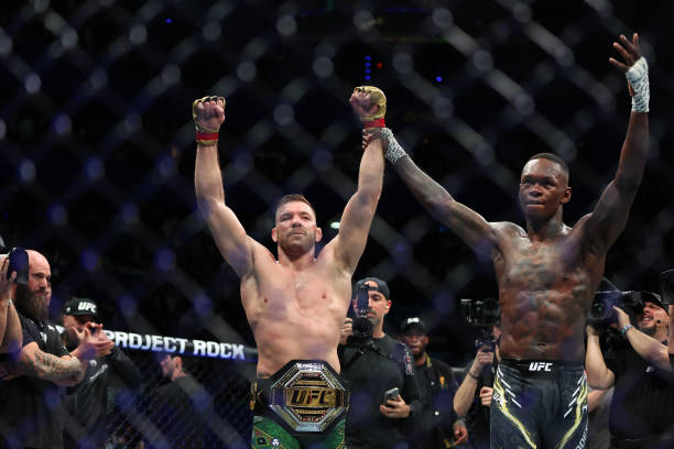 Dricus Du Plessis and Israel Adesanya after winning the Middleweight championship fight by submission during UFC 305 on August 18, 2024 in Perth, Australia. (Photo by Paul Kane/Getty Images).